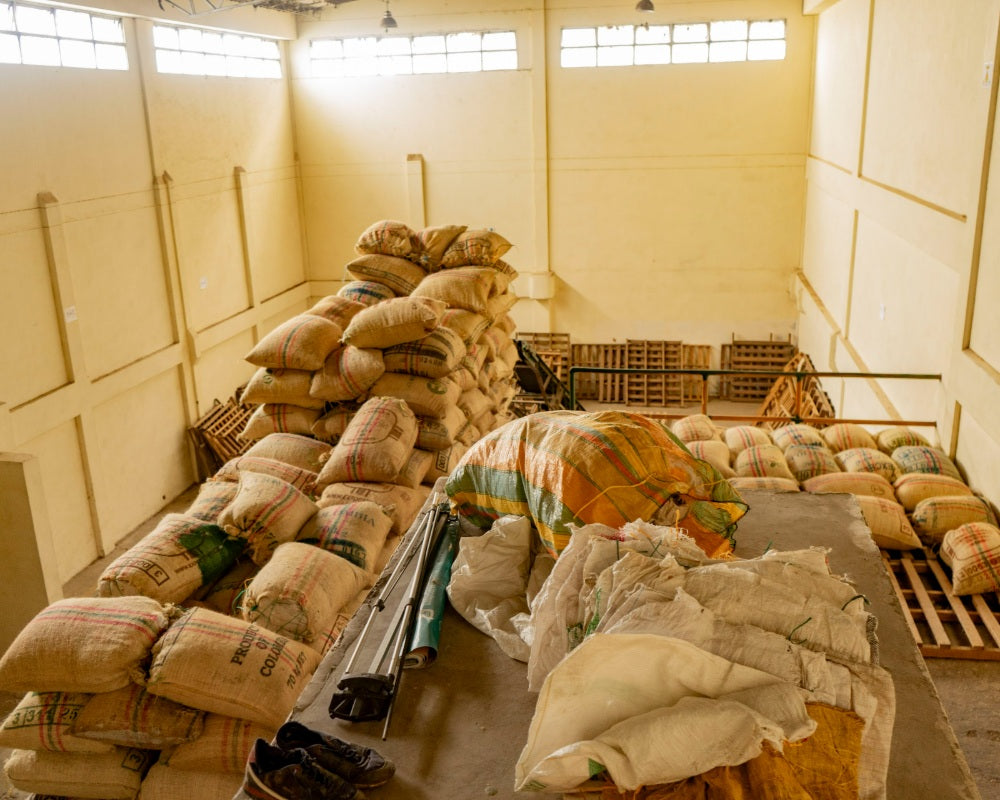 A warehouse filled with sacks of Colombian coffee beans