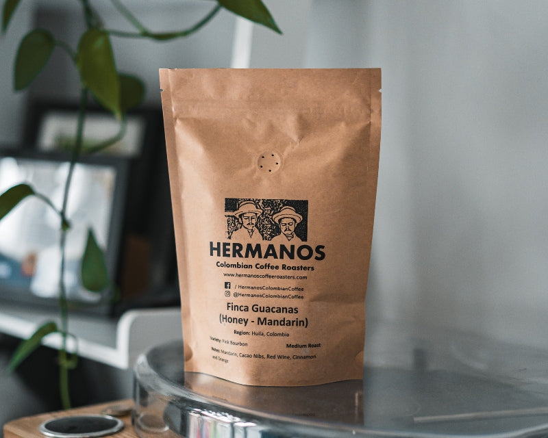 A bag of Hermanos Colombian coffee beans produced at high altitudes with unique fruity and acidic coffee flavour