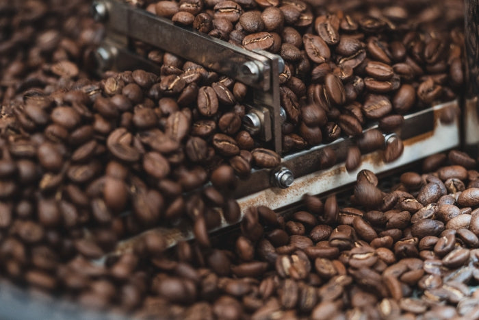 Close up of different coffee roasts in roasting machine