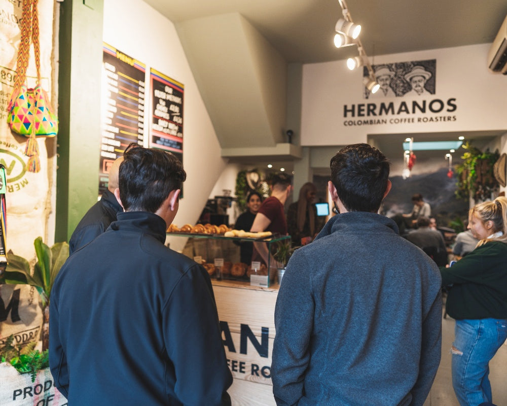 Elias and Shady Bayter seeing their El Vergel specialty coffee in Hermanos shops