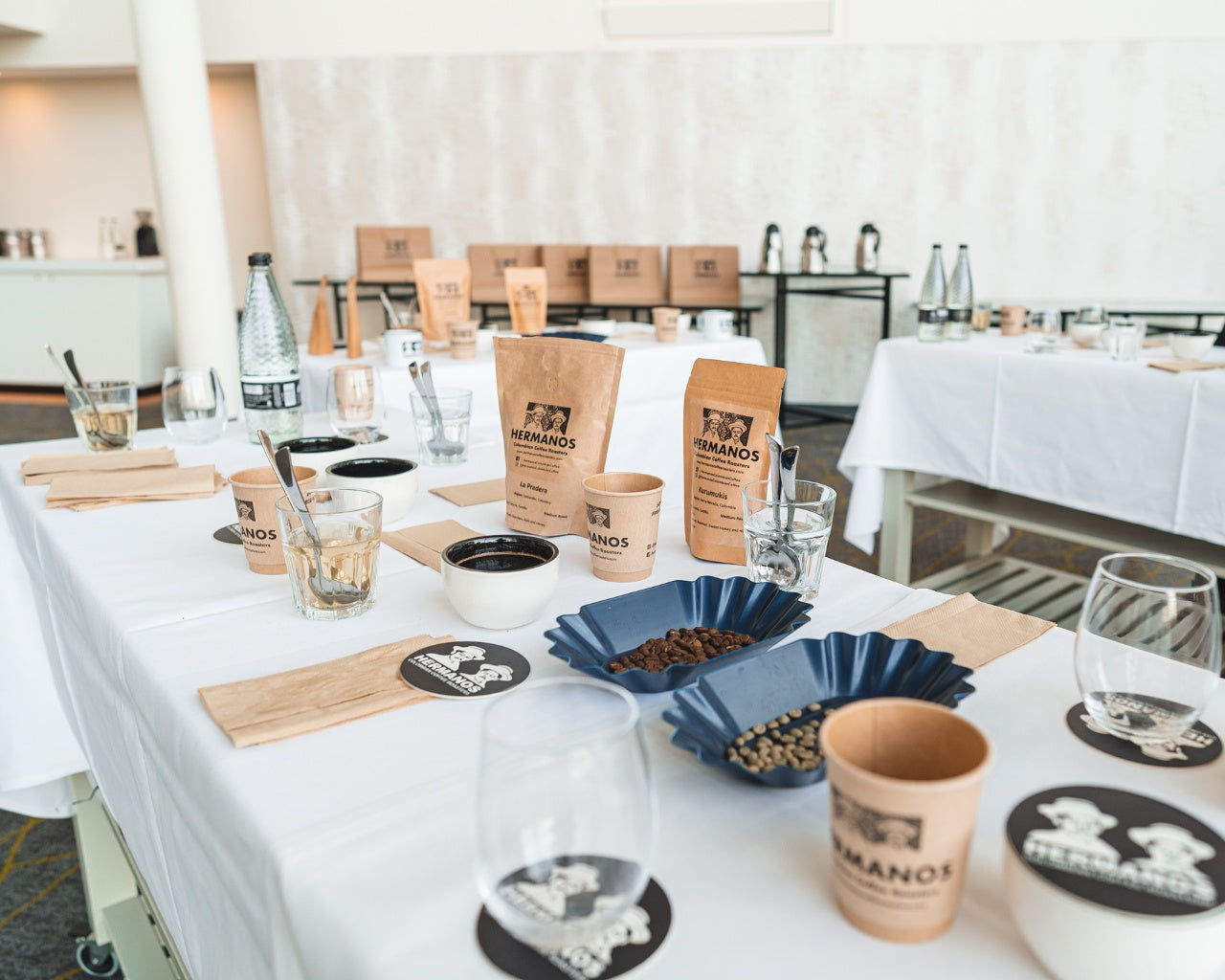 An example of a coffee tasting station during a coffee cupping event with Hermanos coffee tasting guides