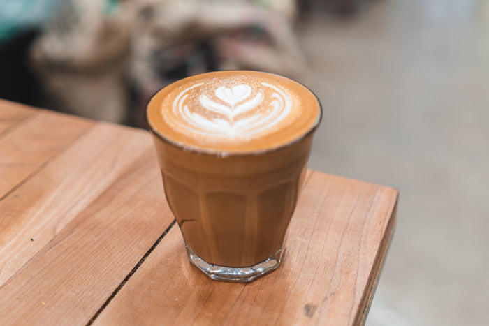 A glass of Hermanos medium roasted coffee in London roastery