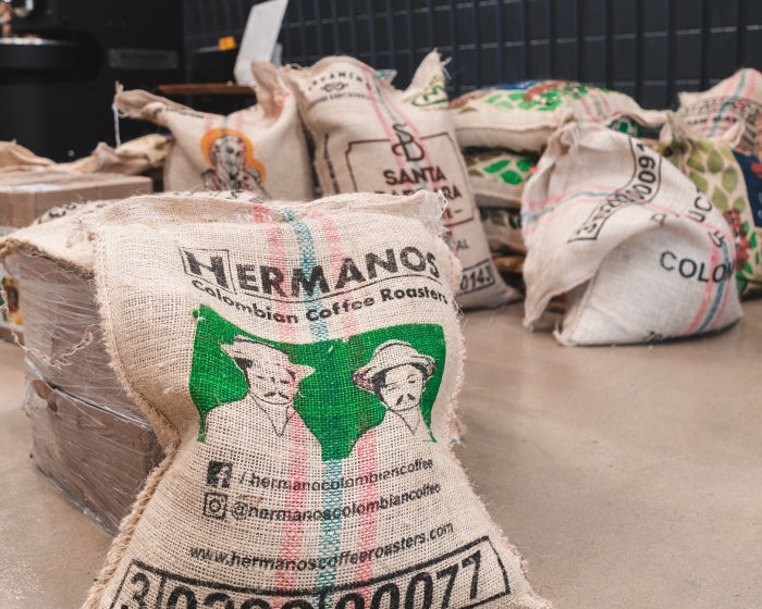 Hermanos coffee sack containing specialty arabica coffee beans from Colombia